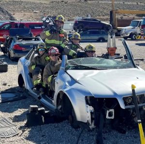 a crew after they have taken a car apart to practice their extrication skills.